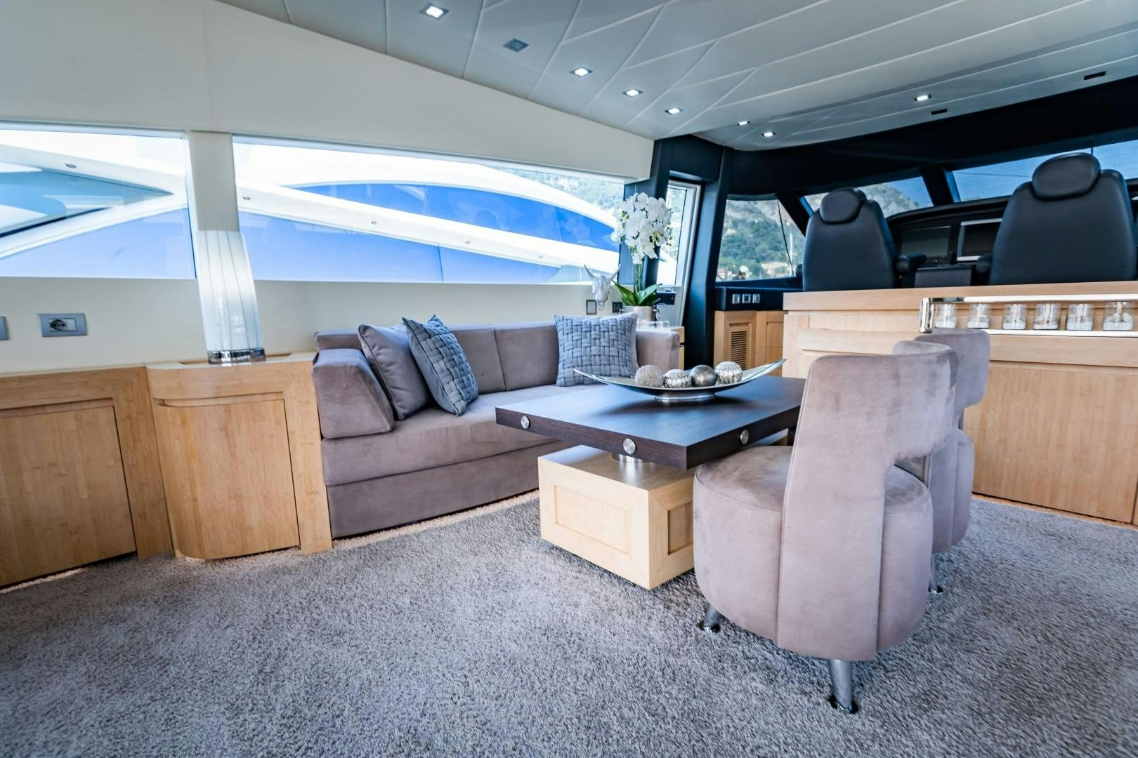 a room with a couch and a table aboard REVEIL Yacht for Sale