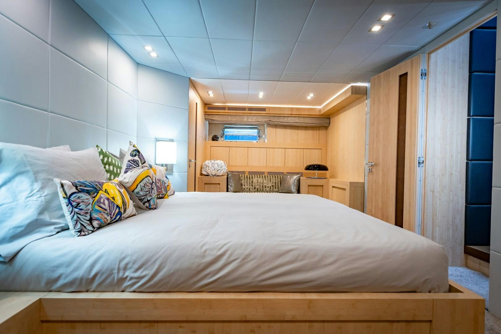 a bedroom with a bed and a desk aboard REVEIL Yacht for Sale