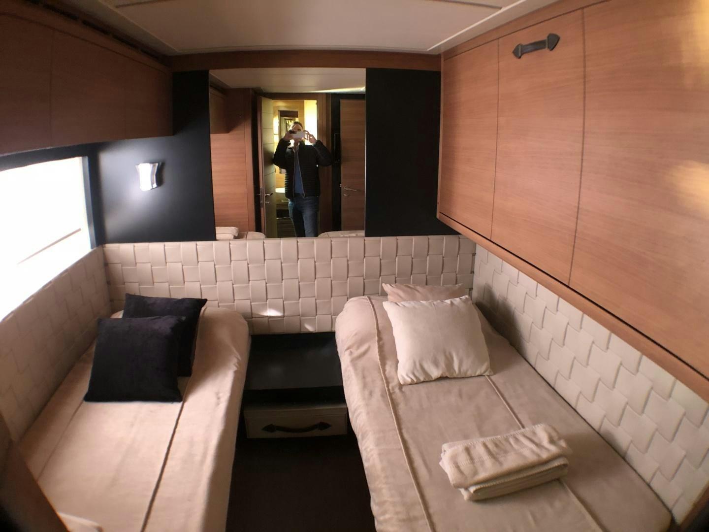 a room with couches and a person standing in the doorway aboard DORIS Yacht for Sale