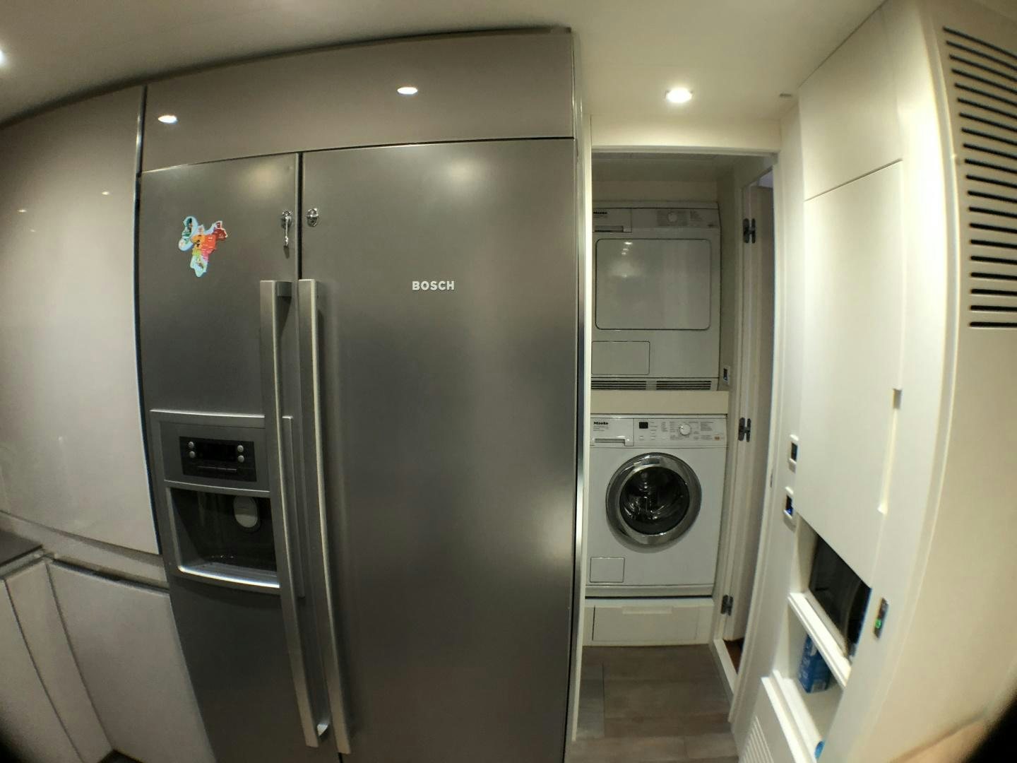 a large refrigerator in a room aboard DORIS Yacht for Sale