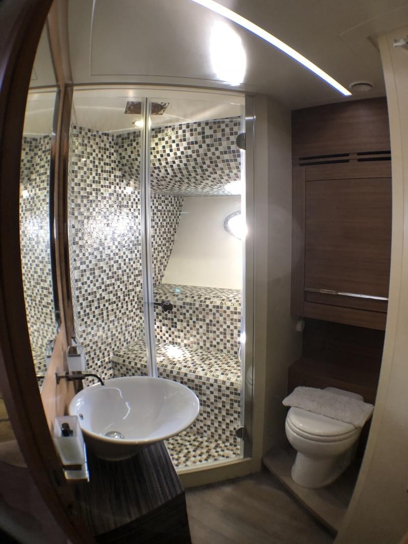 a bathroom with a shower and sink aboard DORIS Yacht for Sale