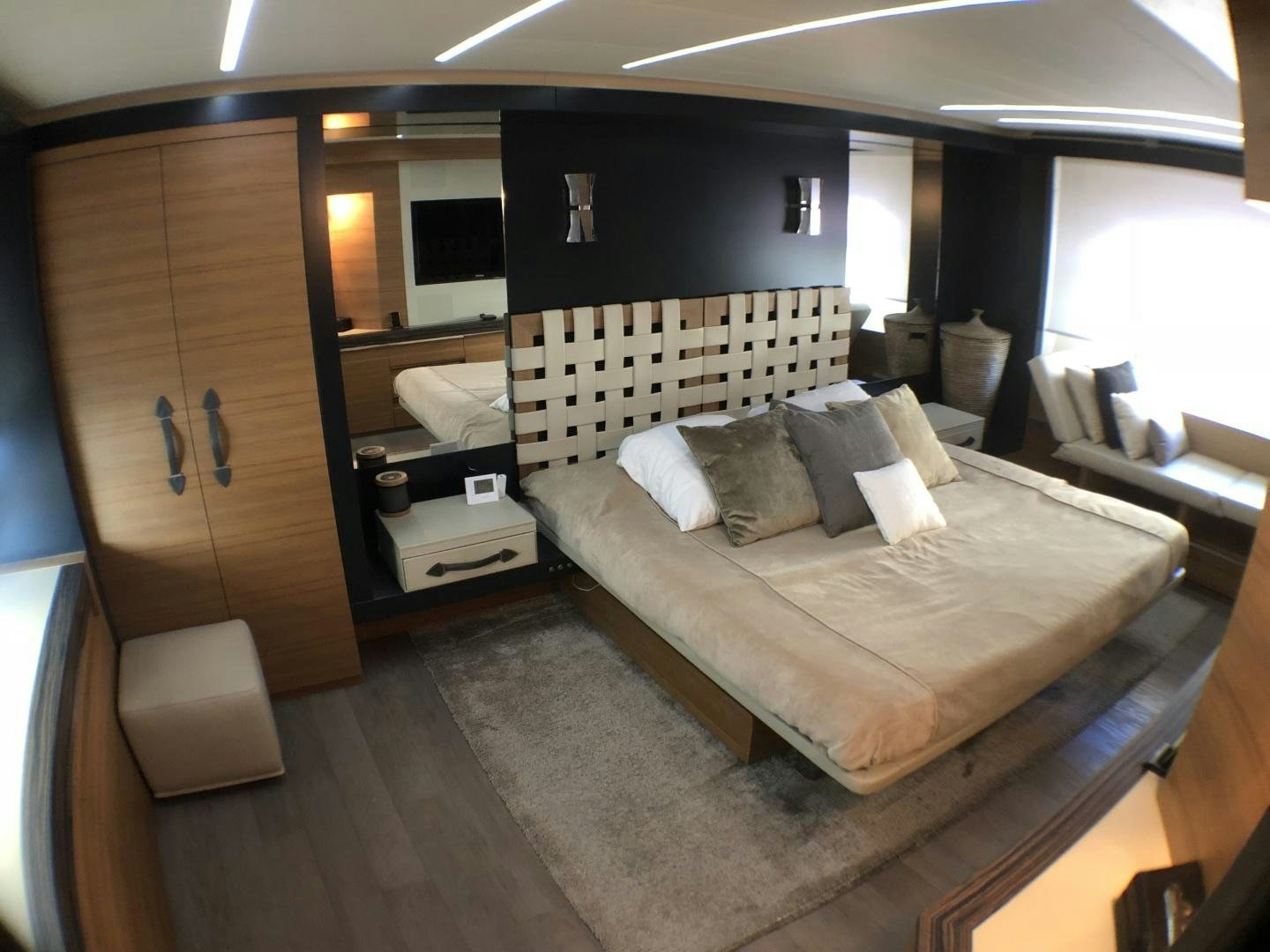 a room with a bed and a desk aboard DORIS Yacht for Sale
