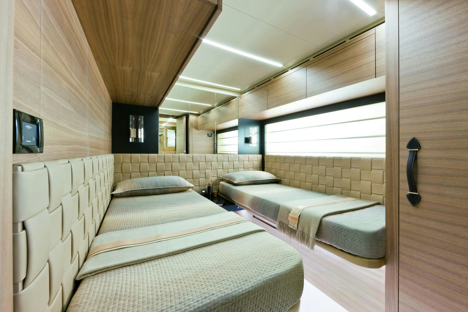 a room with a couple of beds aboard DORIS Yacht for Sale