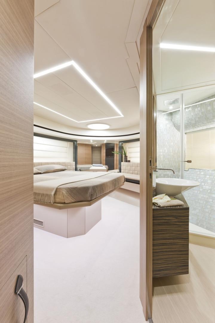 a bathroom with a sink and a bed aboard DORIS Yacht for Sale