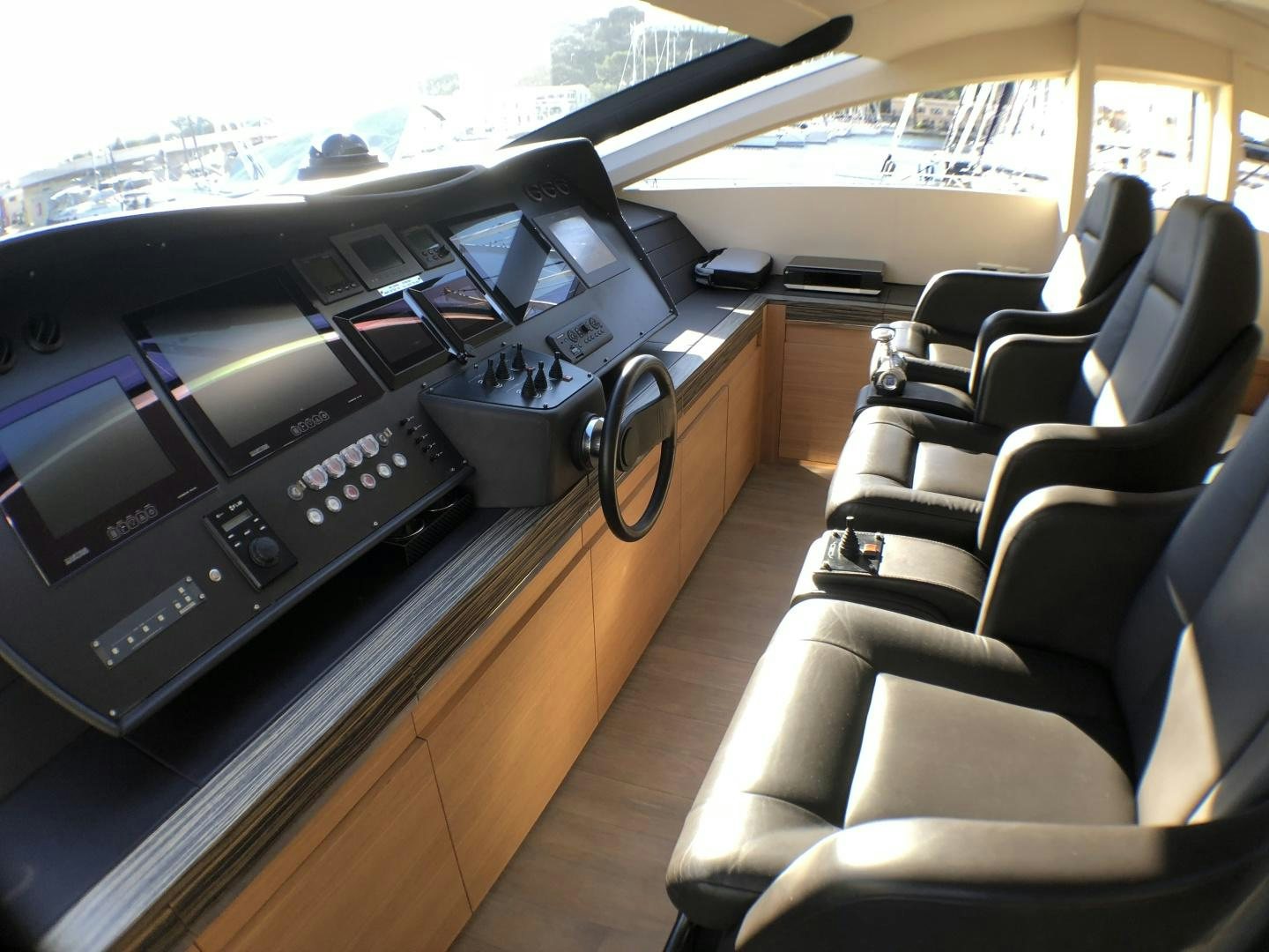 a car with a desk and chairs aboard DORIS Yacht for Sale