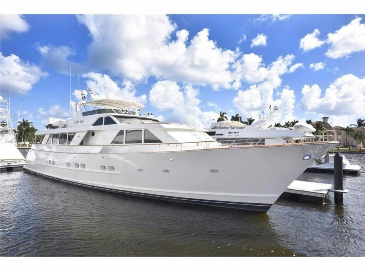 a large white yacht aboard LUCKY STAR Yacht for Sale