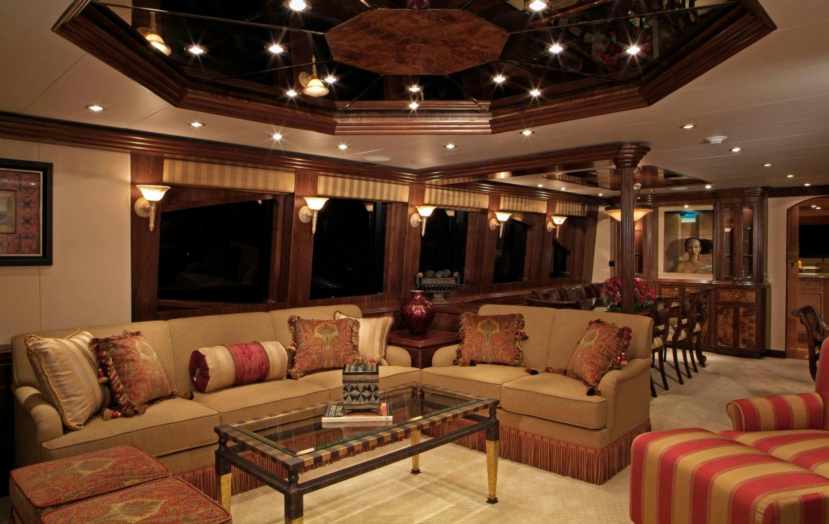 a living room with a large fireplace aboard MABUHAY LIMA Yacht for Sale