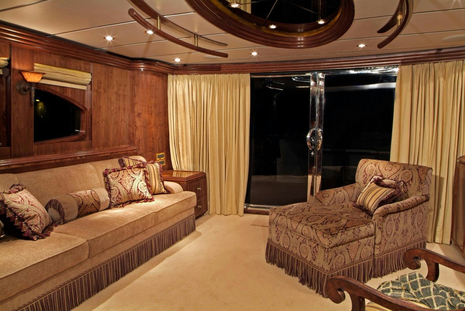 a living room with a leather couch aboard MABUHAY LIMA Yacht for Sale