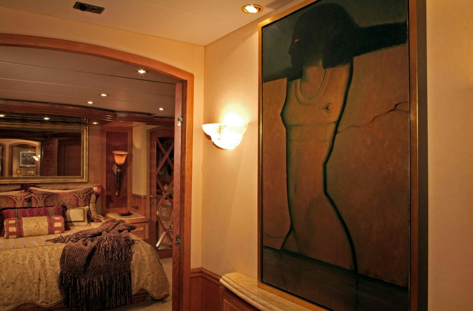 a bedroom with a large mirror aboard MABUHAY LIMA Yacht for Sale