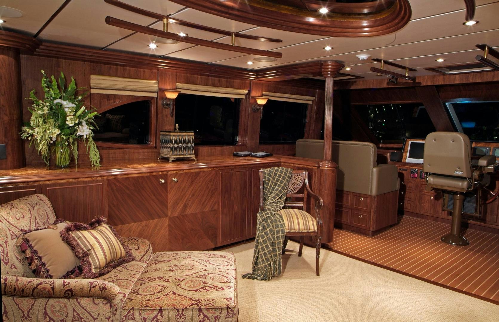 a living room with a piano aboard MABUHAY LIMA Yacht for Sale