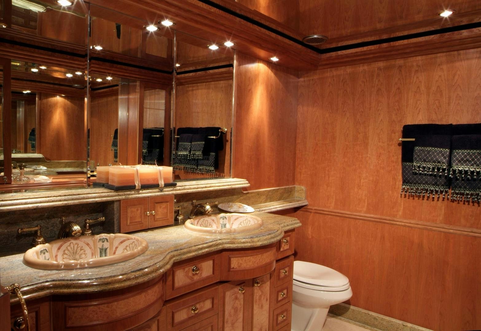 a bathroom with a large mirror aboard MABUHAY LIMA Yacht for Sale