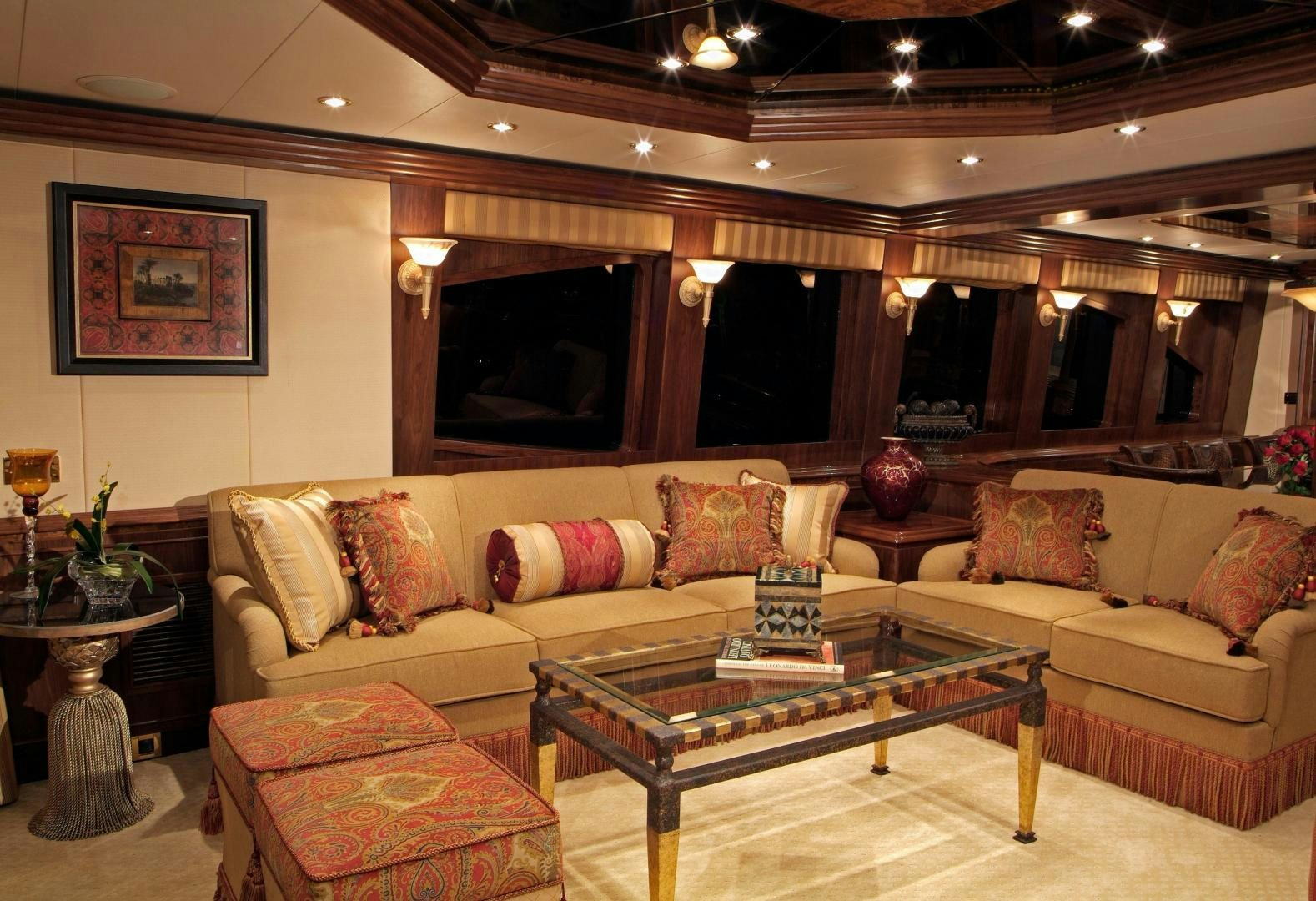a living room with a large sofa aboard MABUHAY LIMA Yacht for Sale