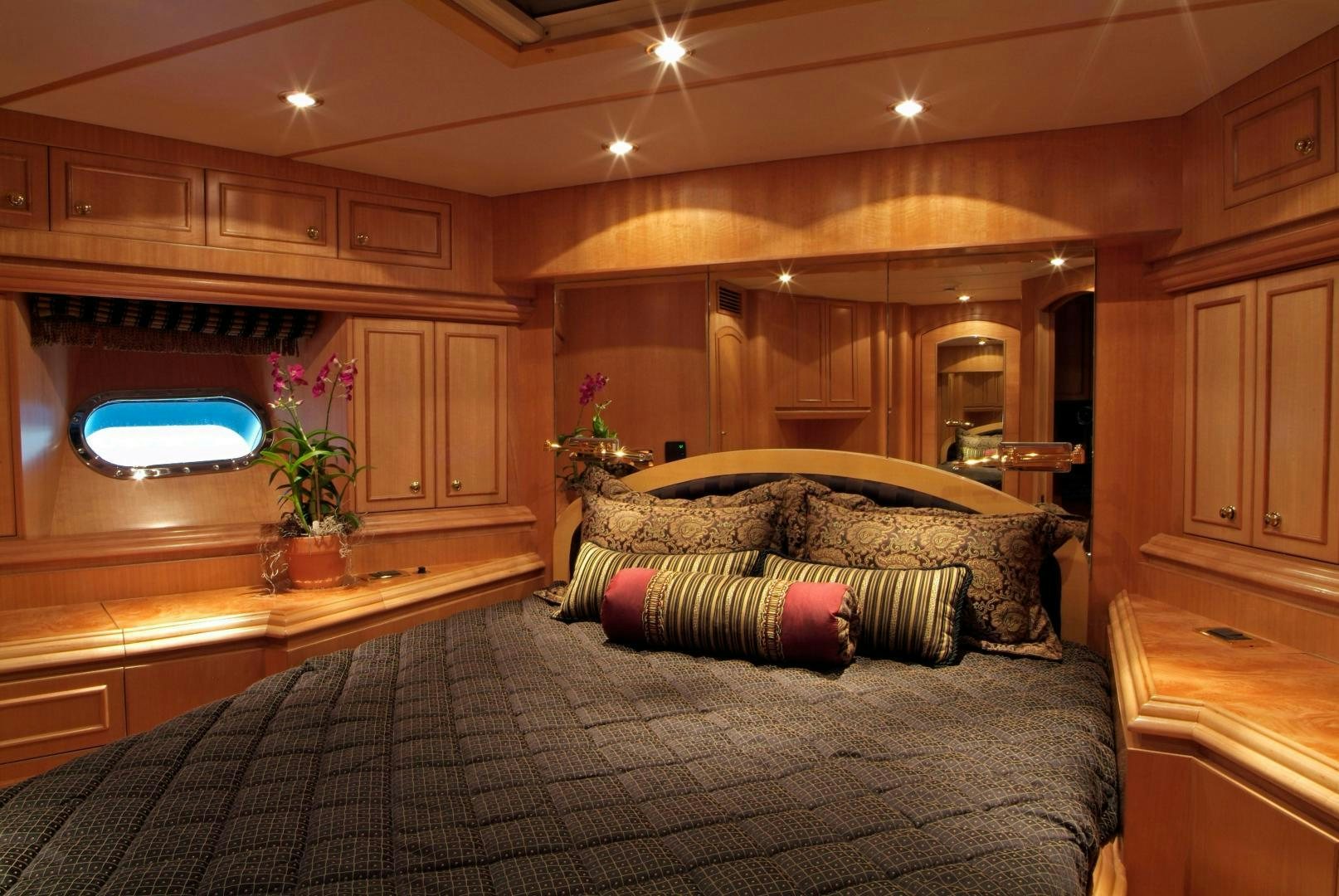 a large bedroom with a large bed aboard MABUHAY LIMA Yacht for Sale