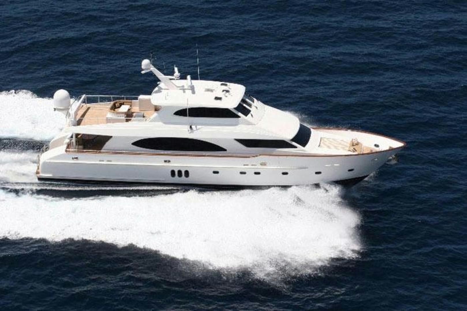 a white yacht on the water aboard MABUHAY LIMA Yacht for Sale