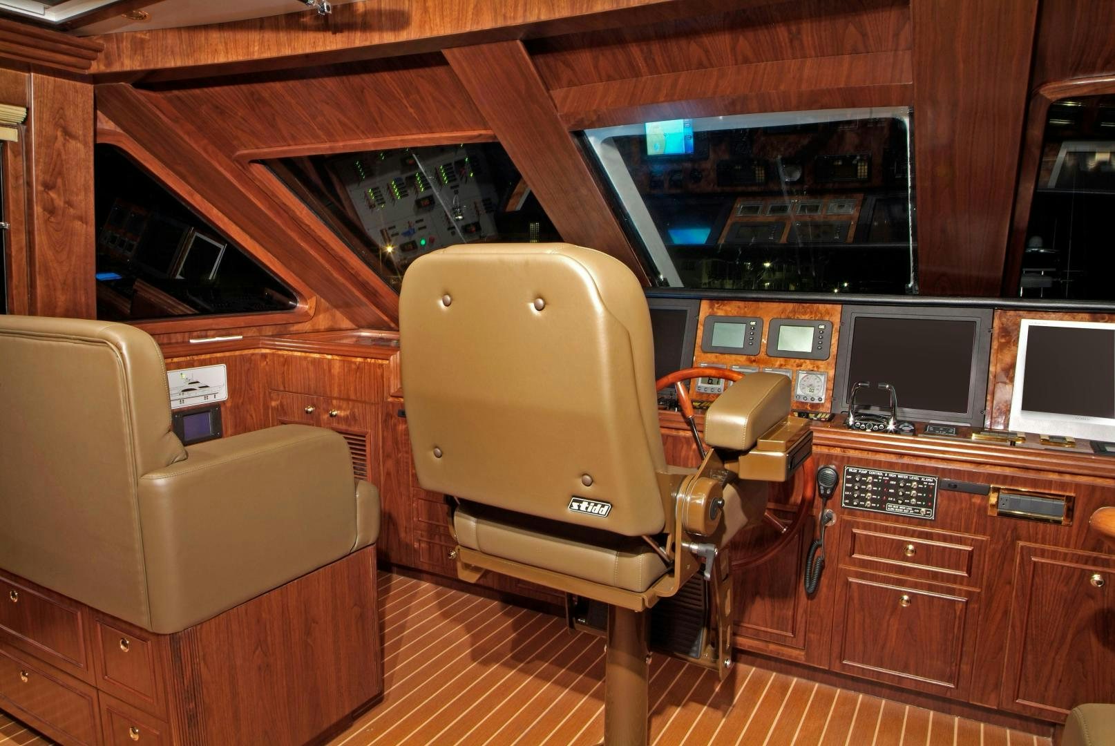 a chair in a room aboard MABUHAY LIMA Yacht for Sale