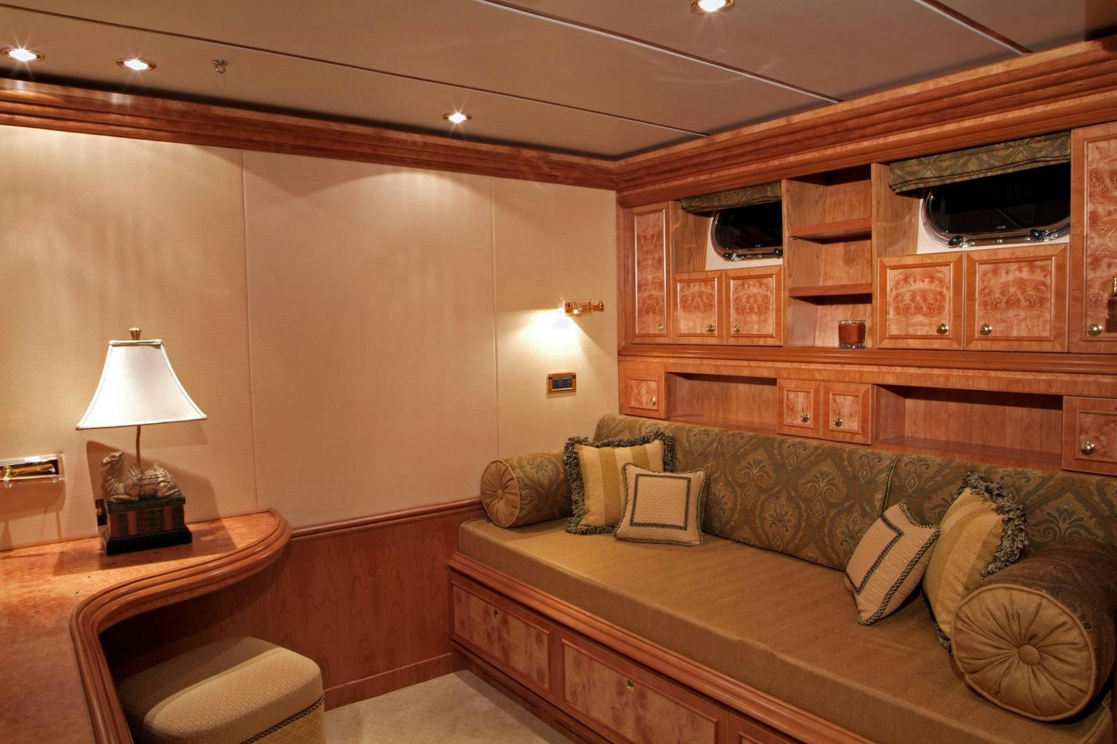 a living room with a couch and a shelf aboard MABUHAY LIMA Yacht for Sale