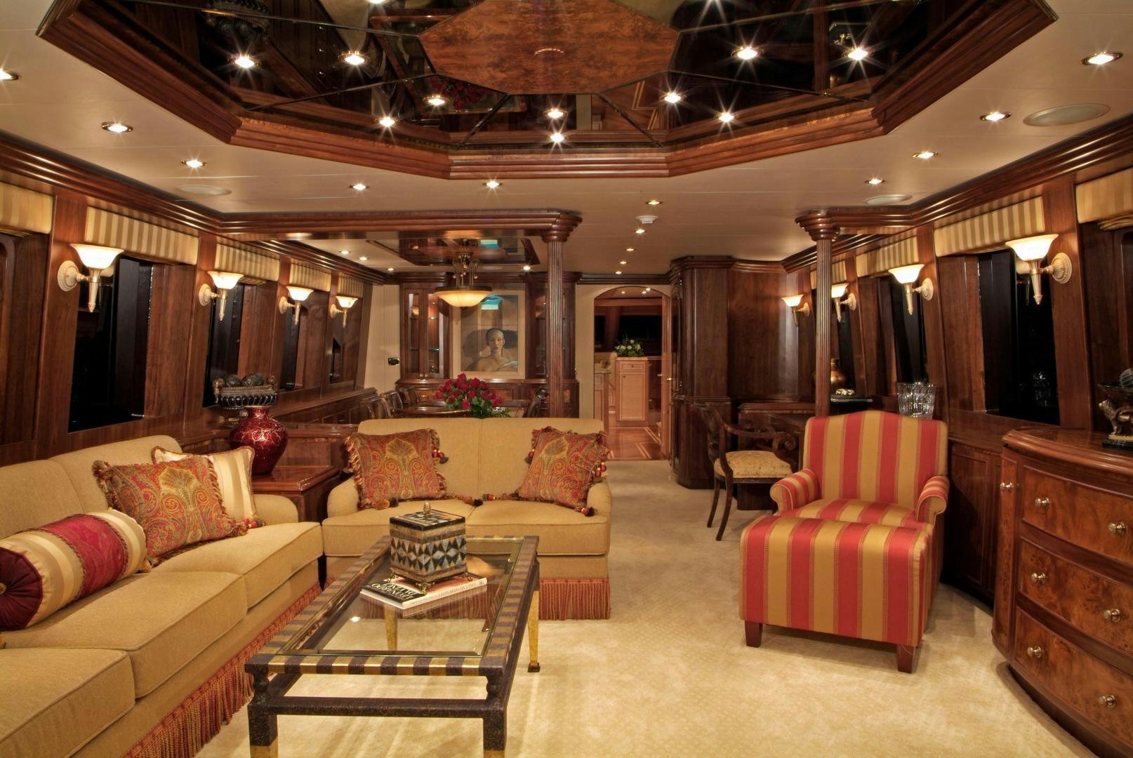 a living room with a couch and a table aboard MABUHAY LIMA Yacht for Sale