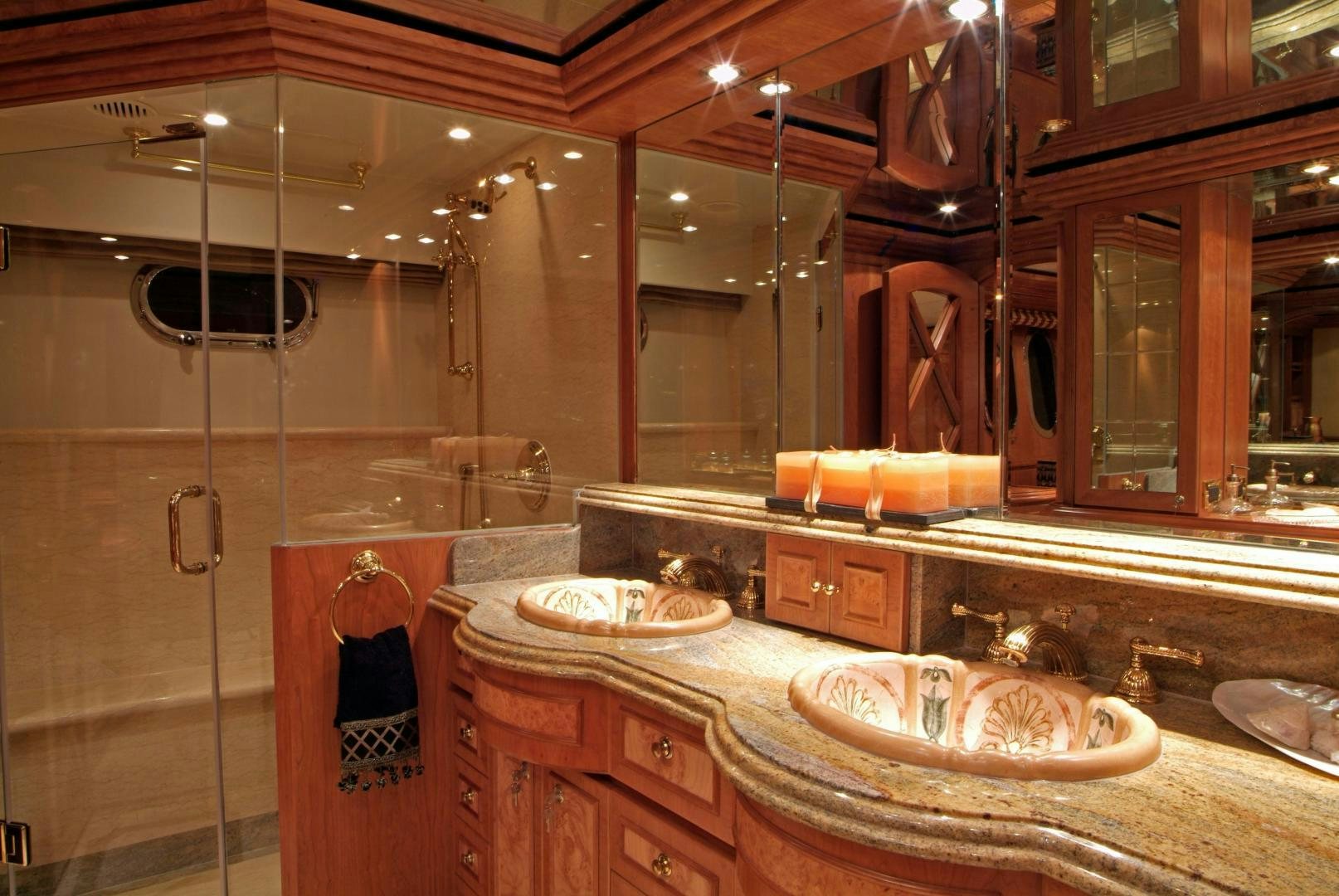 a bathroom with a large mirror aboard MABUHAY LIMA Yacht for Sale