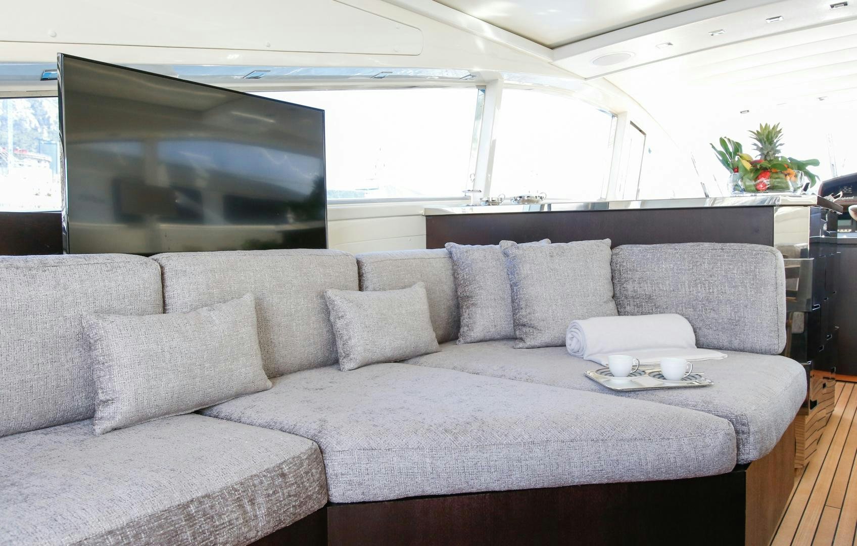 a couch with a coffee table aboard THE OFFICE Yacht for Sale