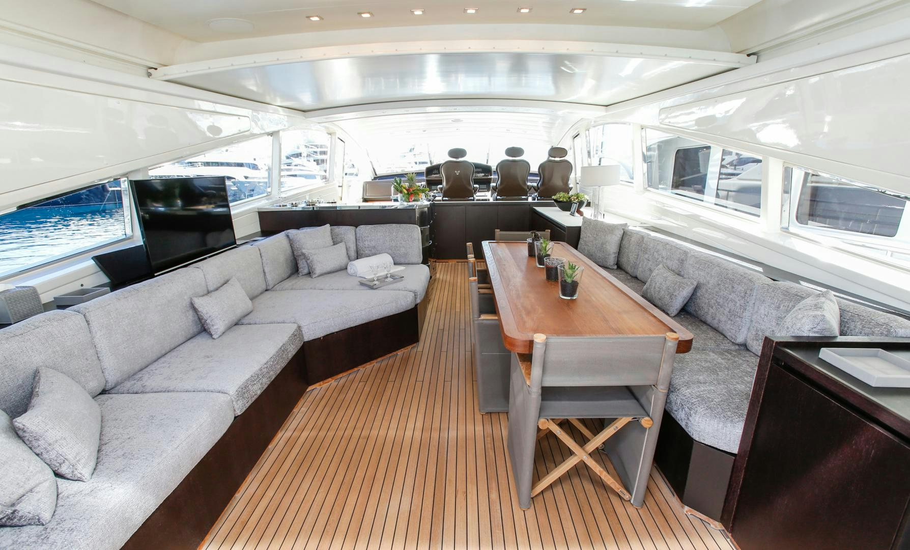 a living room with a couch and a table aboard THE OFFICE Yacht for Sale