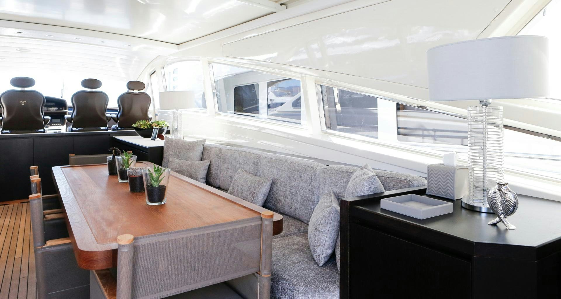 a living room with a couch and a table aboard THE OFFICE Yacht for Sale