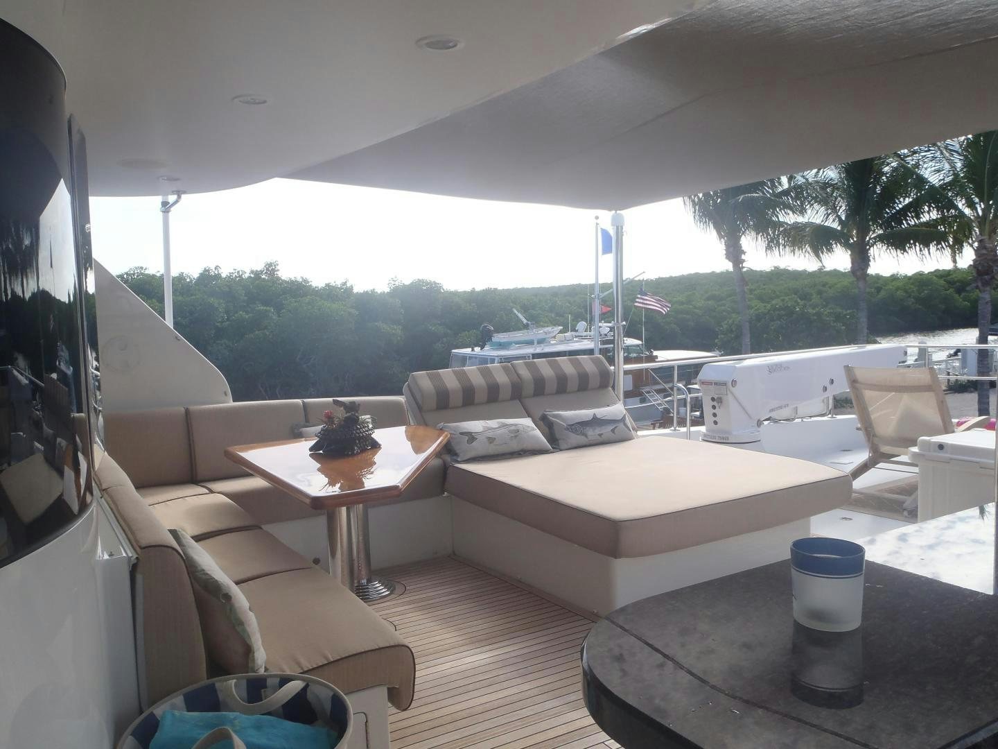 a living room with a couch and a table aboard CLAYPEN Yacht for Sale
