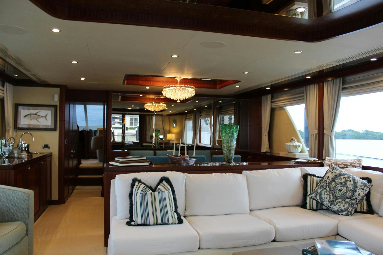 a living room with a large glass window aboard CLAYPEN Yacht for Sale