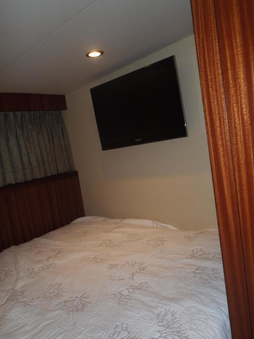 a tv on a wall aboard CLAYPEN Yacht for Sale