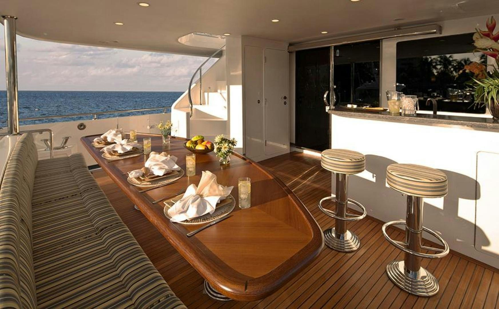 a kitchen with a table and chairs aboard CLAYPEN Yacht for Sale