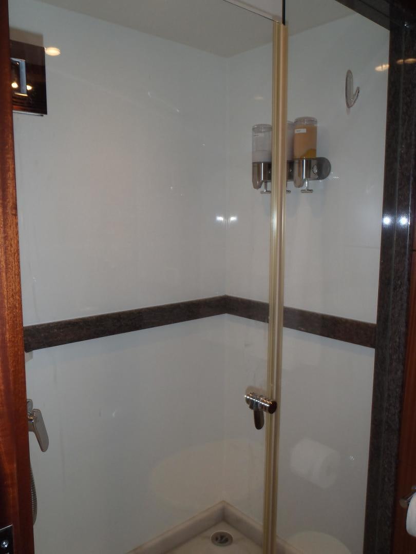 a shower with a glass door aboard CLAYPEN Yacht for Sale