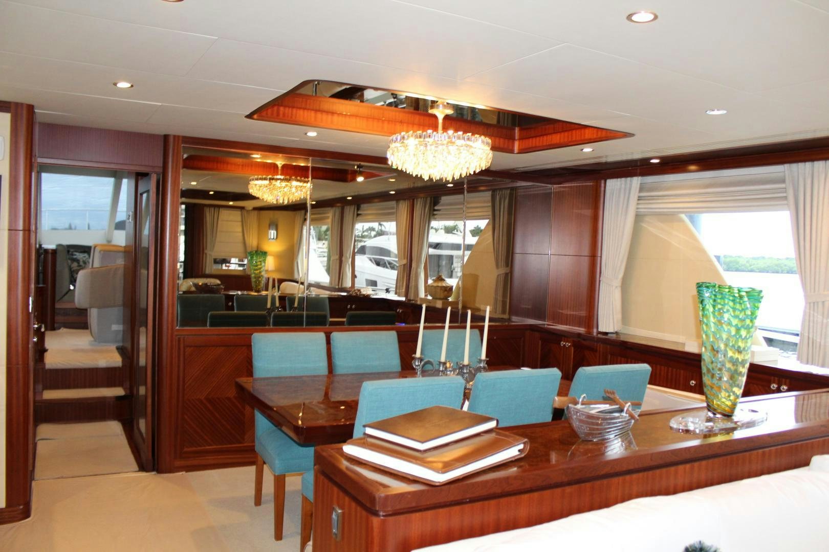 a room with a table and chairs aboard CLAYPEN Yacht for Sale