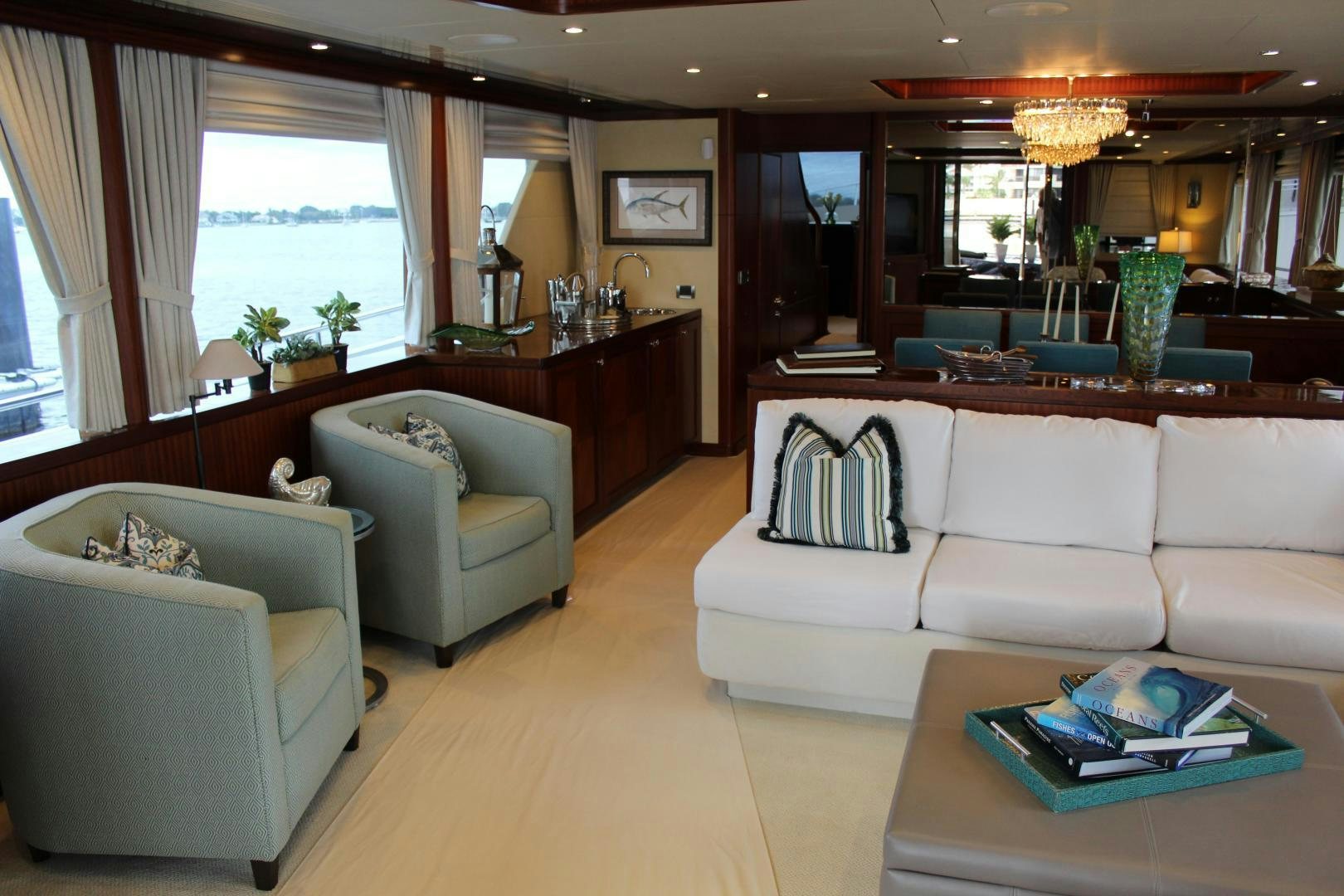 a living room with a couch and a table aboard CLAYPEN Yacht for Sale