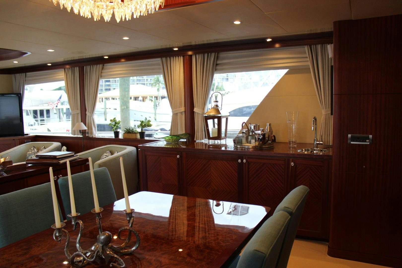 a dining room with a table and chairs aboard CLAYPEN Yacht for Sale