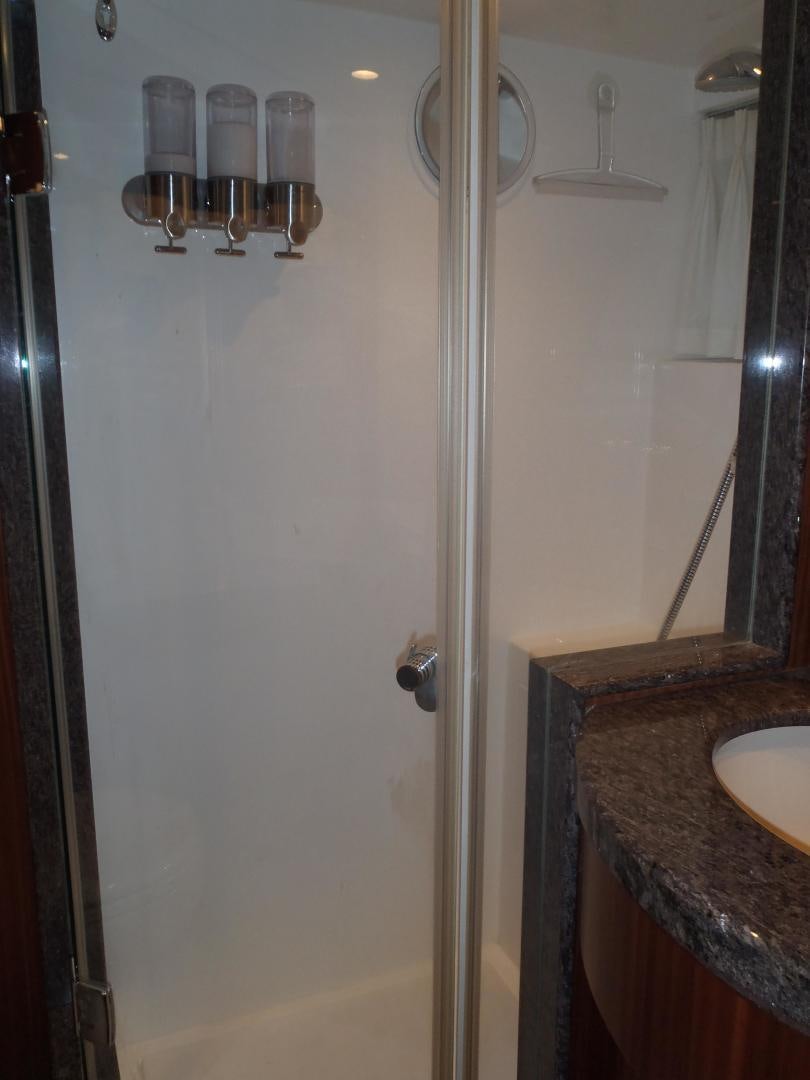 a shower with a glass door aboard CLAYPEN Yacht for Sale