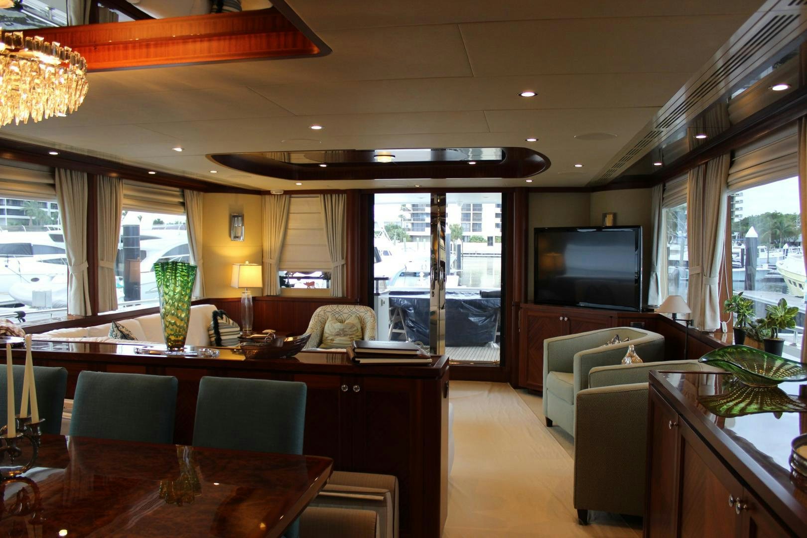 a living room with a large window aboard CLAYPEN Yacht for Sale