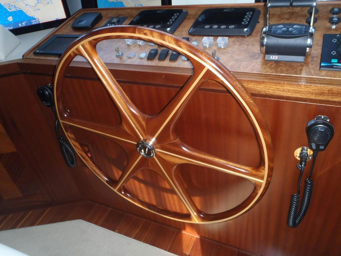 a brown leather case with a brown leather strap on a wooden surface aboard CLAYPEN Yacht for Sale