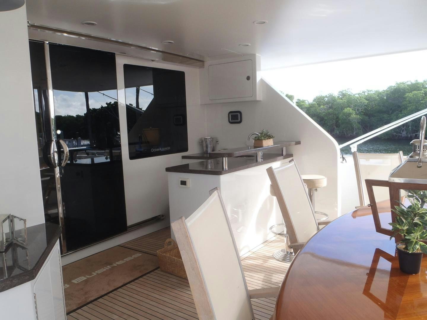 a kitchen with a table and chairs aboard CLAYPEN Yacht for Sale