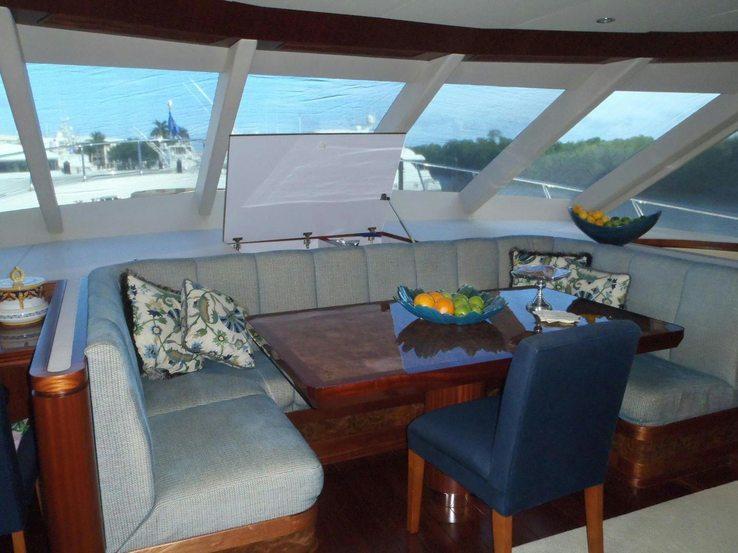 a room with a table and chairs aboard CLAYPEN Yacht for Sale
