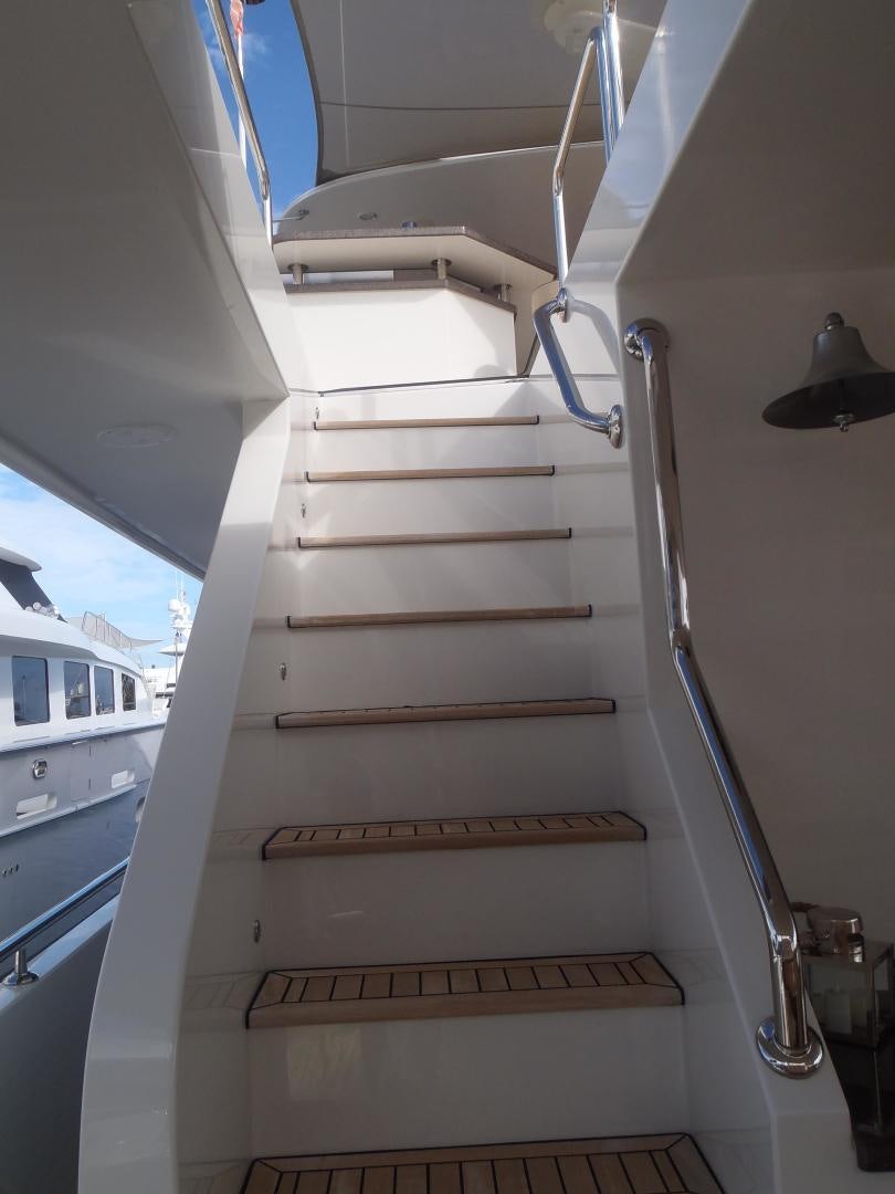 a staircase with a light aboard CLAYPEN Yacht for Sale