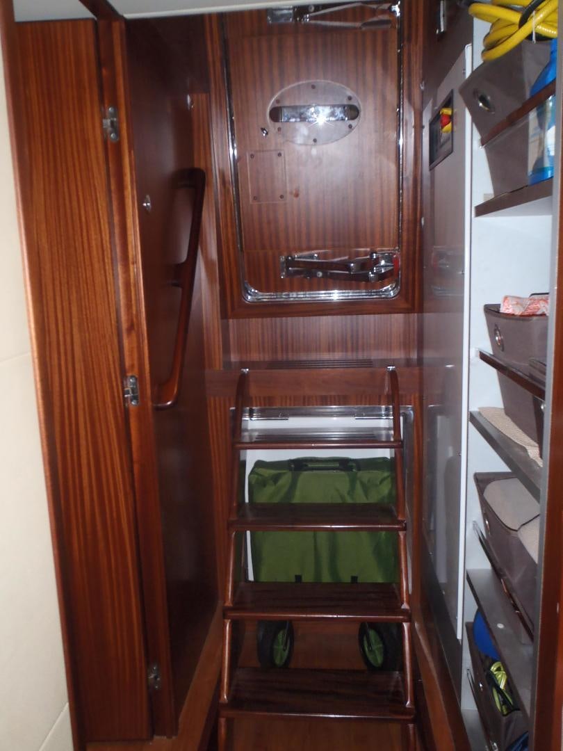 a small refrigerator with a door open aboard CLAYPEN Yacht for Sale