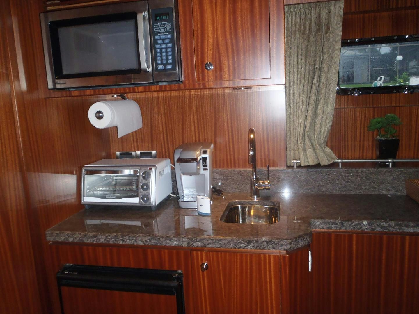 a microwave oven sits on top of a countertop aboard CLAYPEN Yacht for Sale