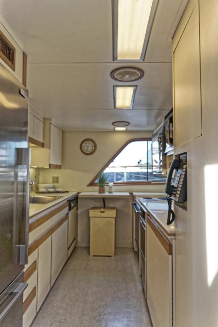 a kitchen with a large window aboard NO NAME Yacht for Sale