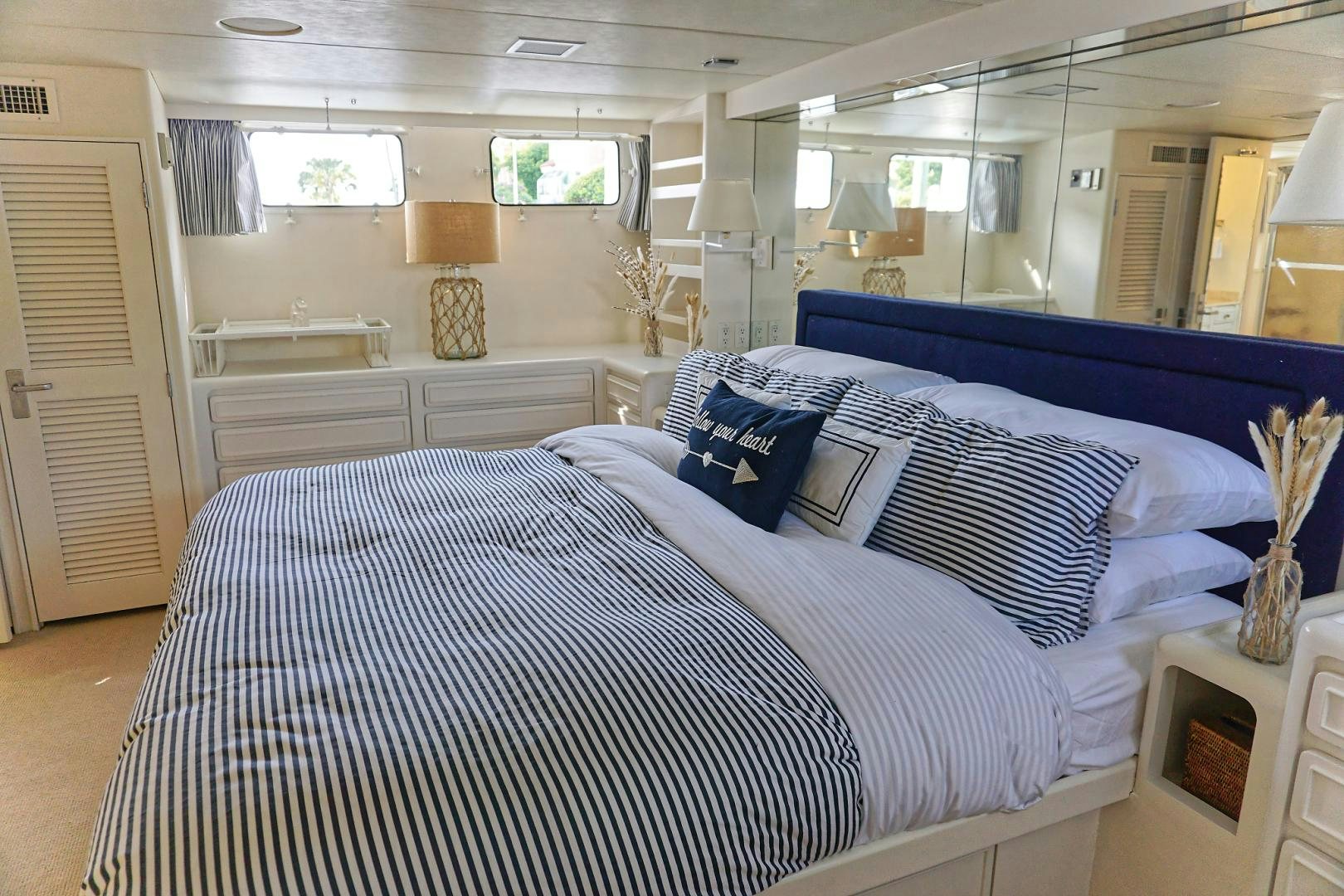a room with a bed and a television aboard NO NAME Yacht for Sale