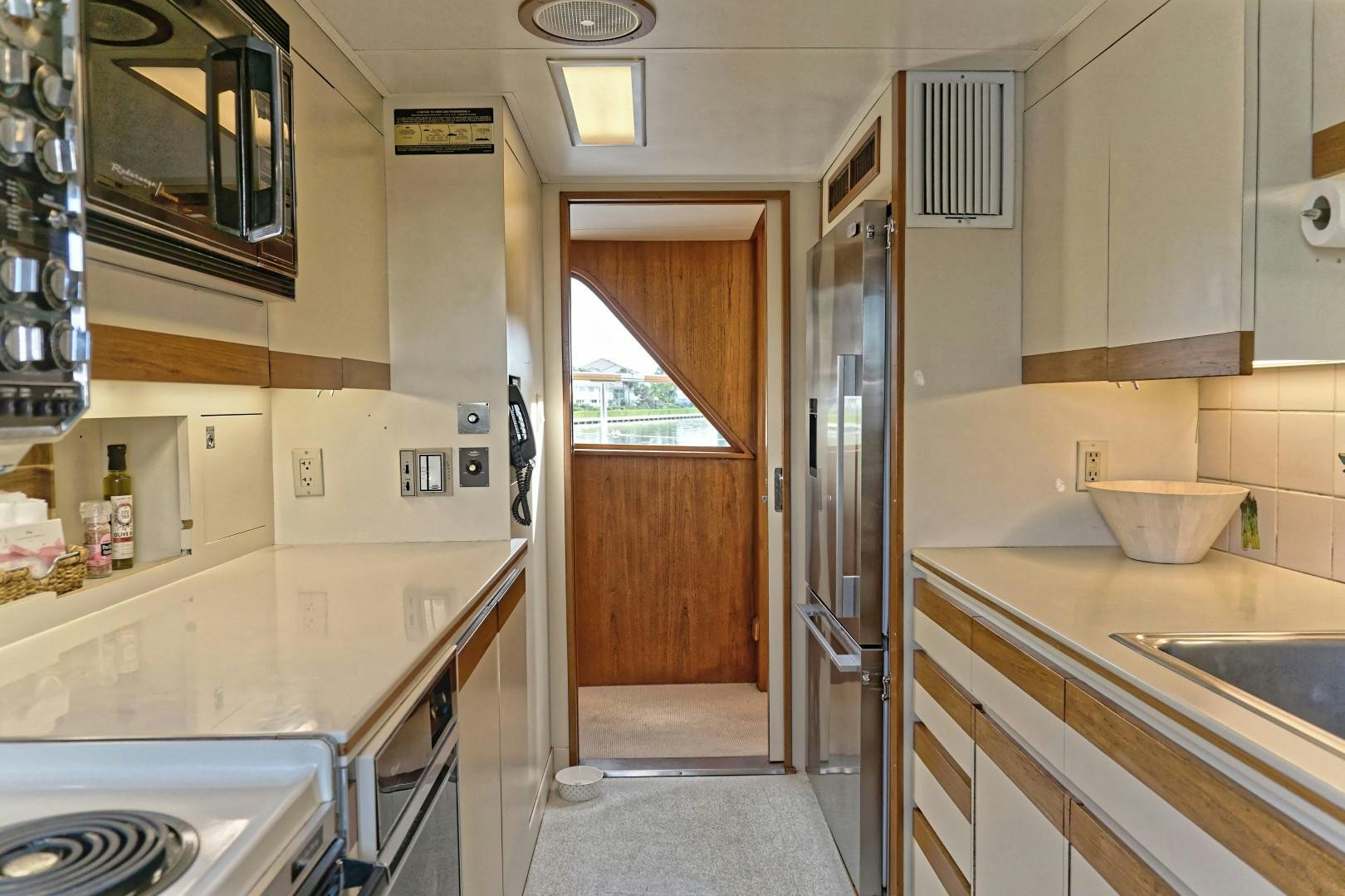 a kitchen with a sink and microwave aboard NO NAME Yacht for Sale
