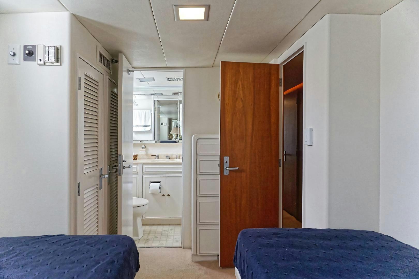 a bedroom with a blue bed aboard NO NAME Yacht for Sale