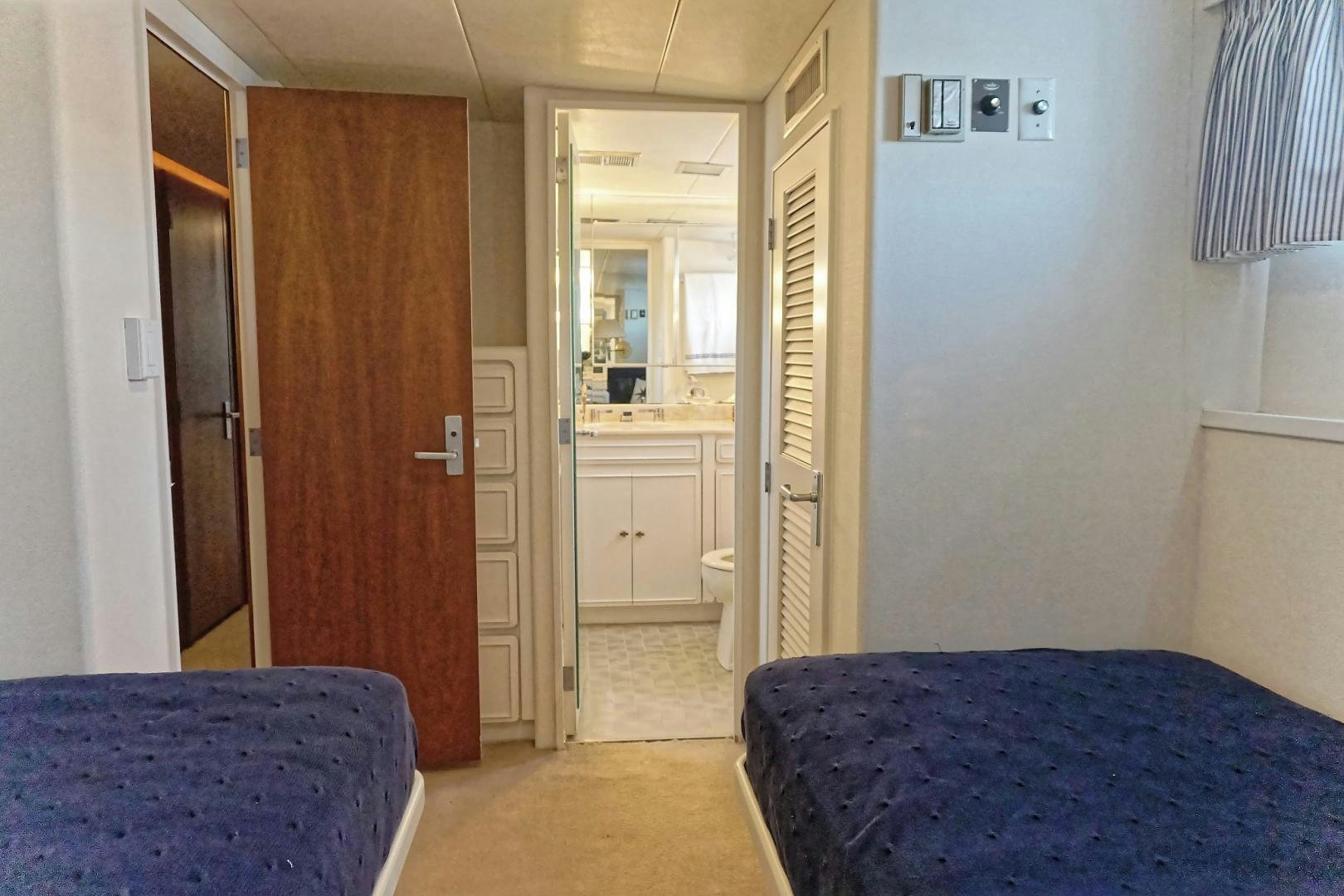 a bedroom with a blue bed aboard NO NAME Yacht for Sale