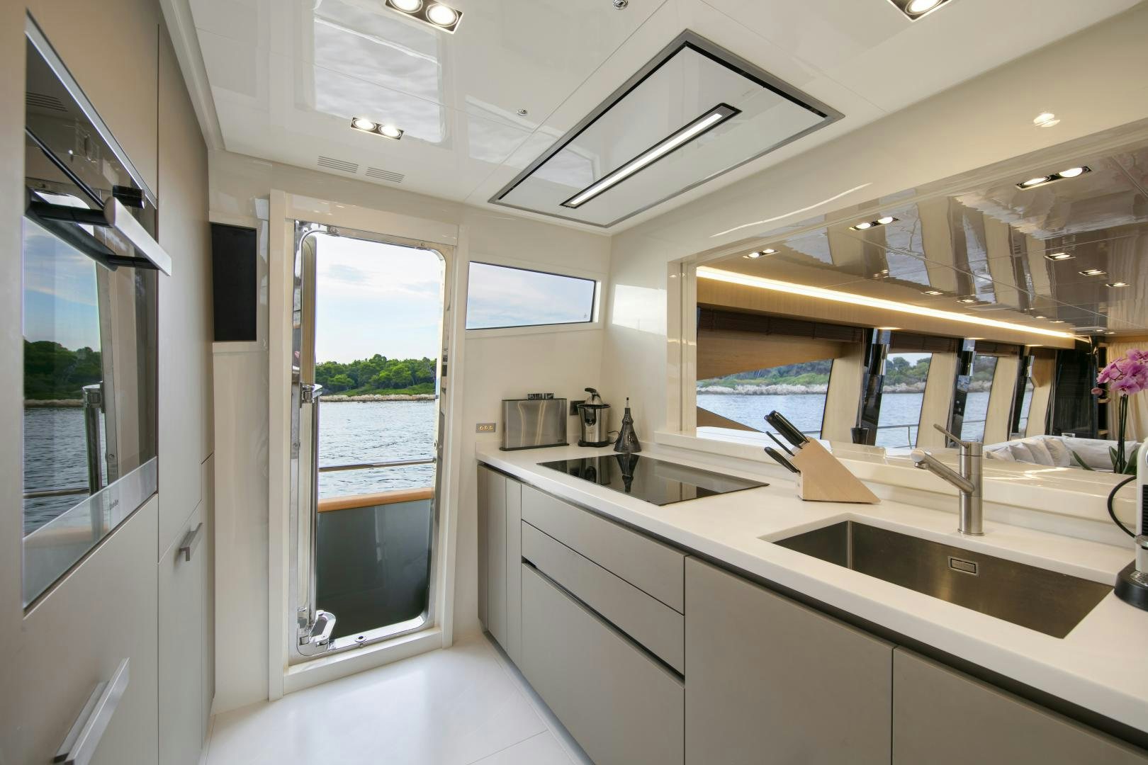 a kitchen with a large window aboard URSUS V Yacht for Sale