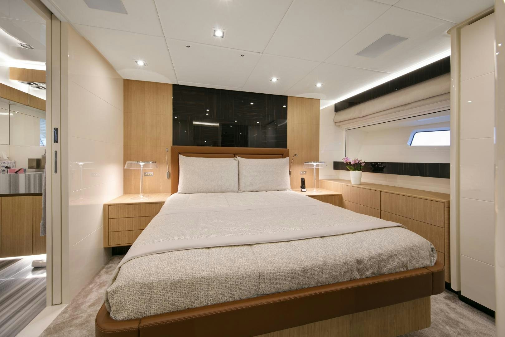 a large bed in a room aboard URSUS V Yacht for Sale