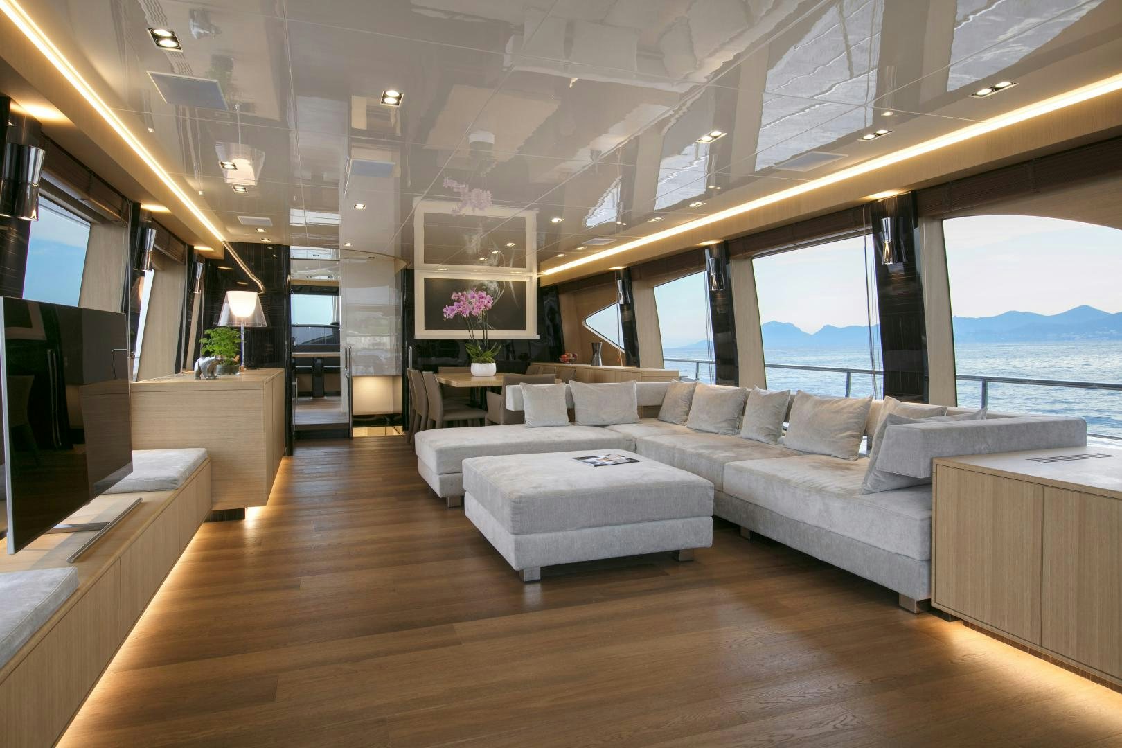 a room with a couch and a table aboard URSUS V Yacht for Sale