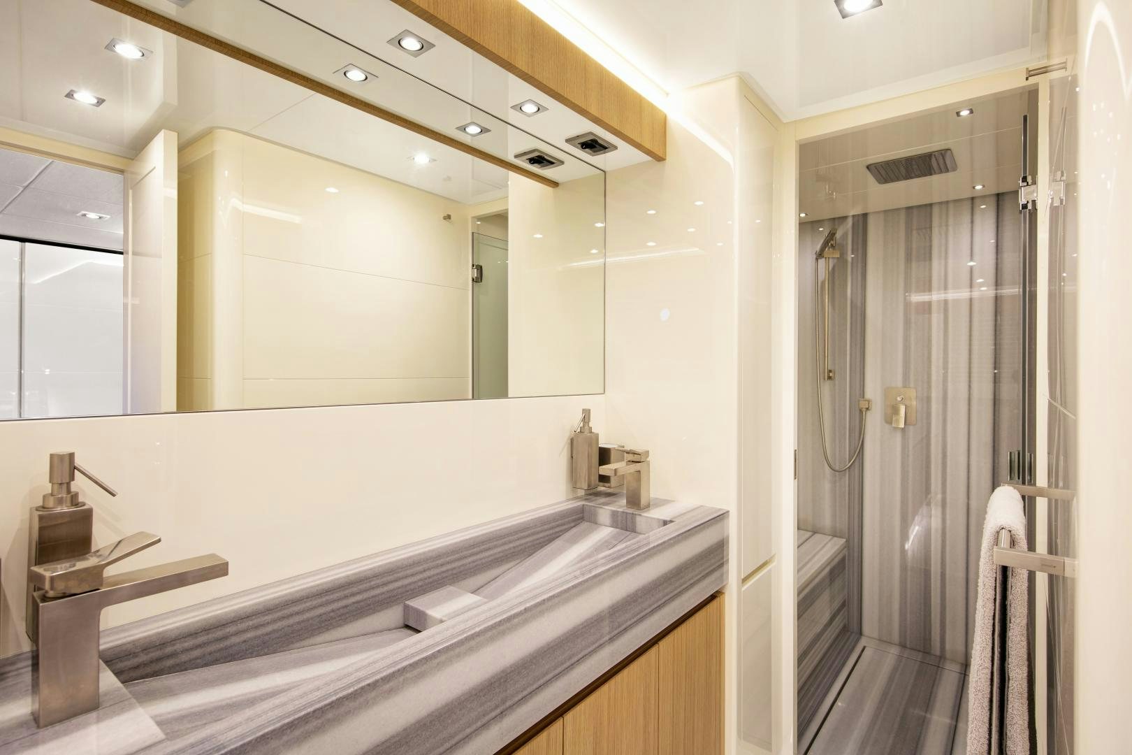 a bathroom with a large mirror aboard URSUS V Yacht for Sale